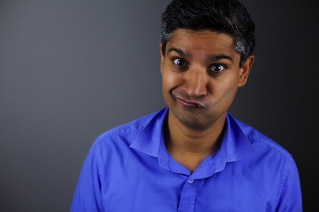 Comedy headshot of Kuldip Korotana in a blue shirt