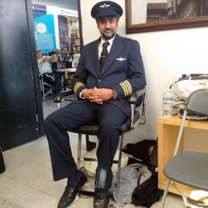 Kuldip Korotana seated in a pilot costume backstage